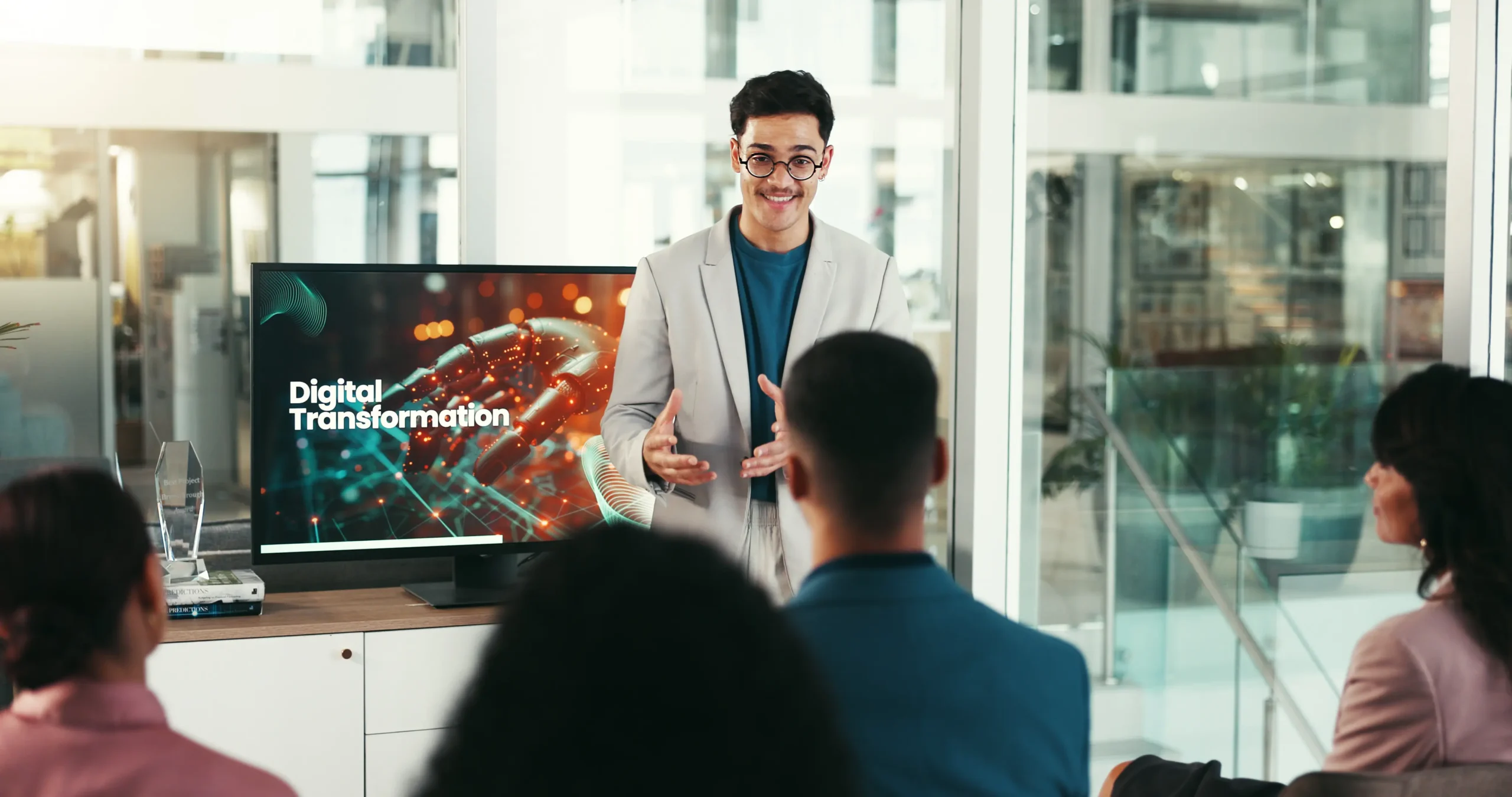 Man talking in a meeting in front of a crowd